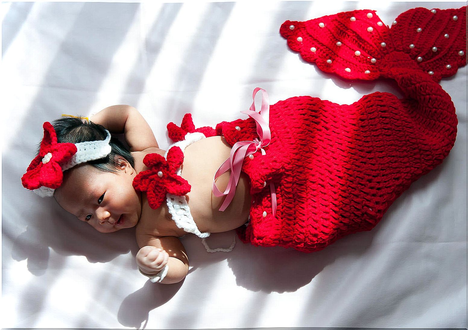 Baby in a mermaid costume.