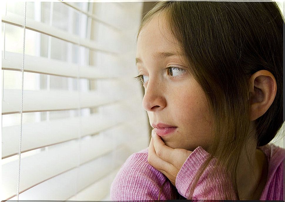 Girl looking out the window during the six-year crisis.