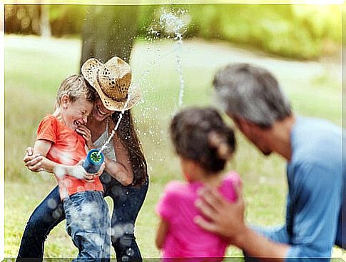 Family playing outdoors.