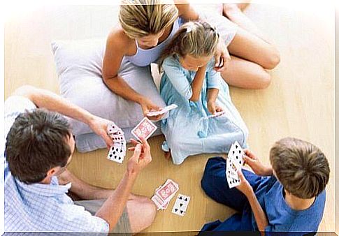 Family playing cards with lots of love.