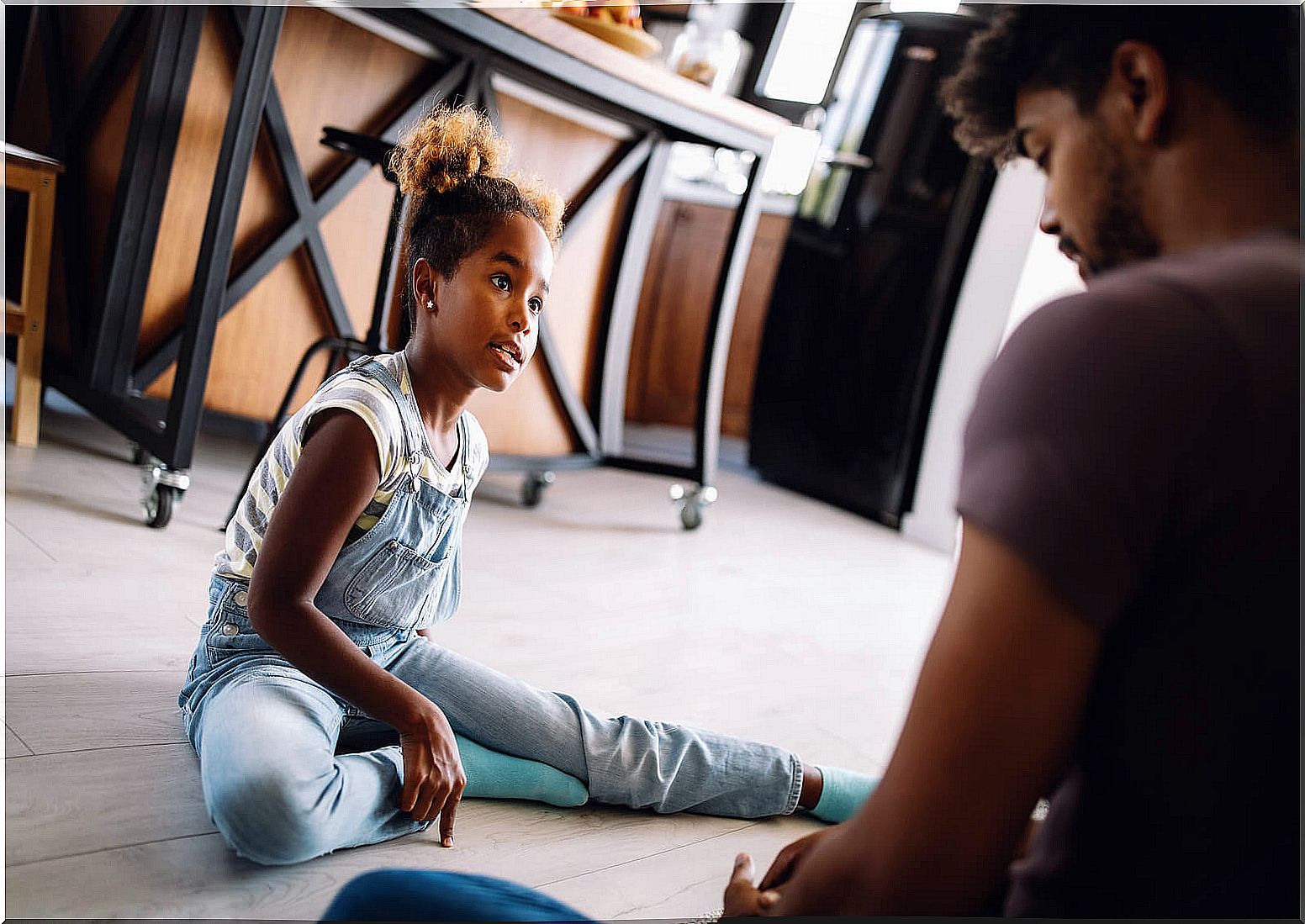 Father talking as a family learning to have more patience with the children.