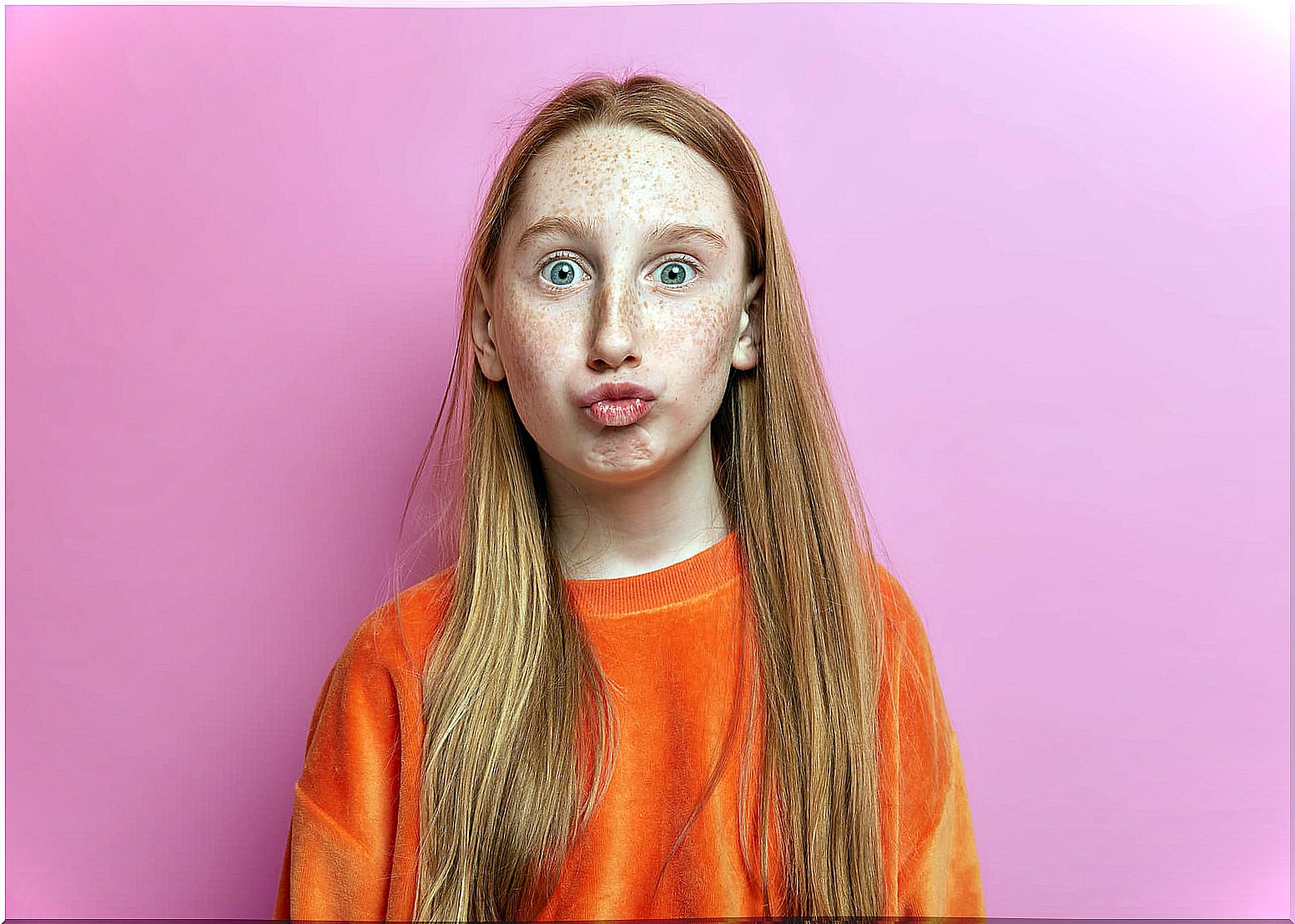 Red-haired girl with freckles.