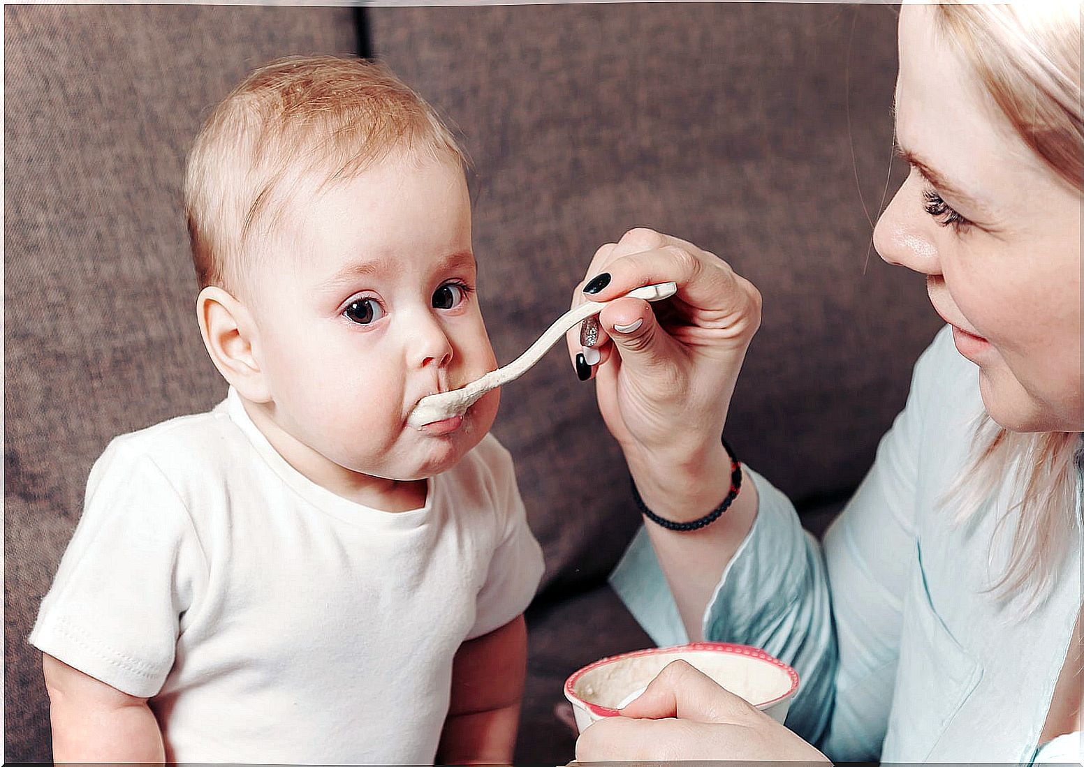 Mother feeding her baby.