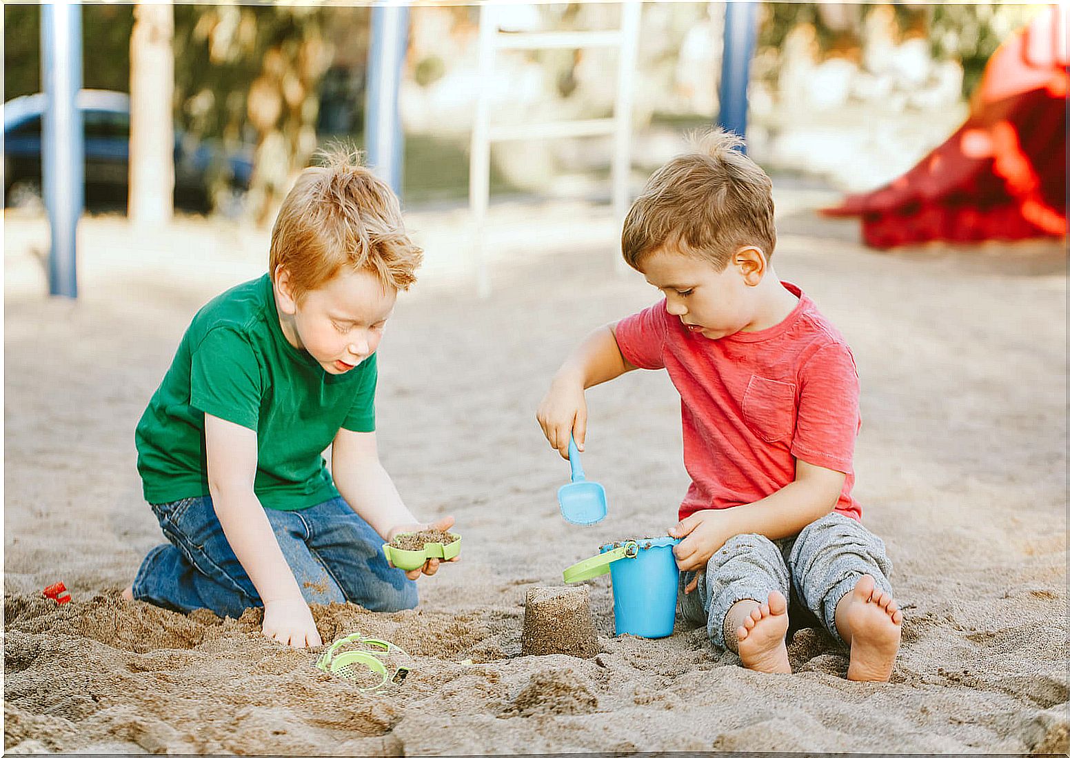 Child playing to make sand castles.