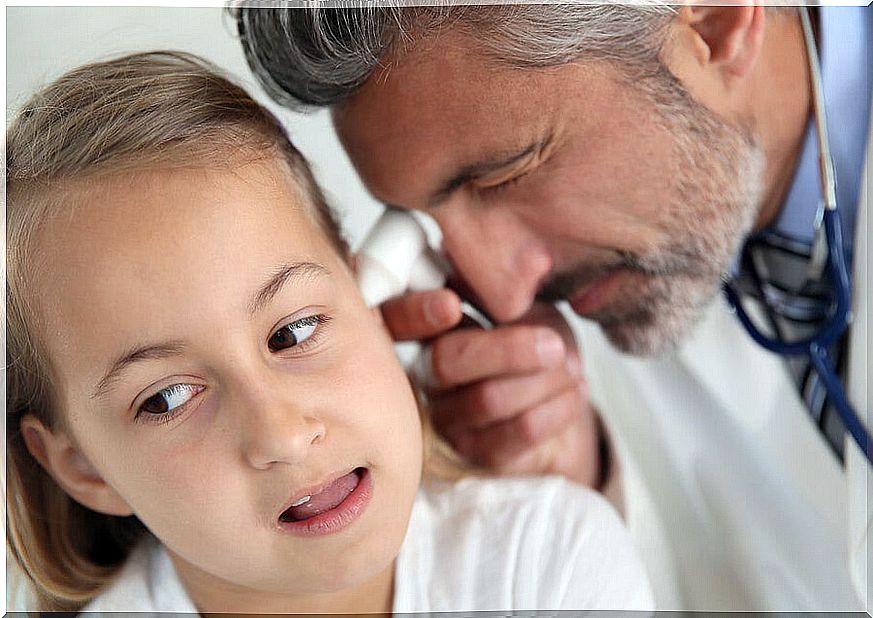 How are ear vegetations treated in children?