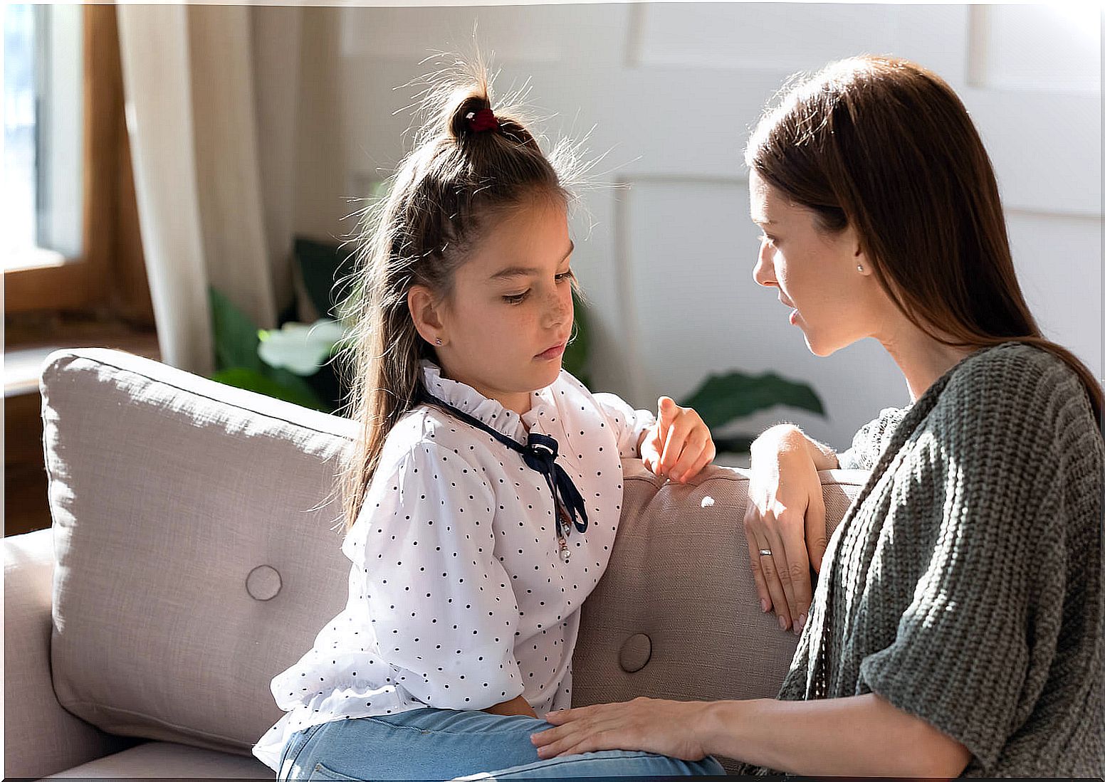 Mother talking to her daughter about cancer.