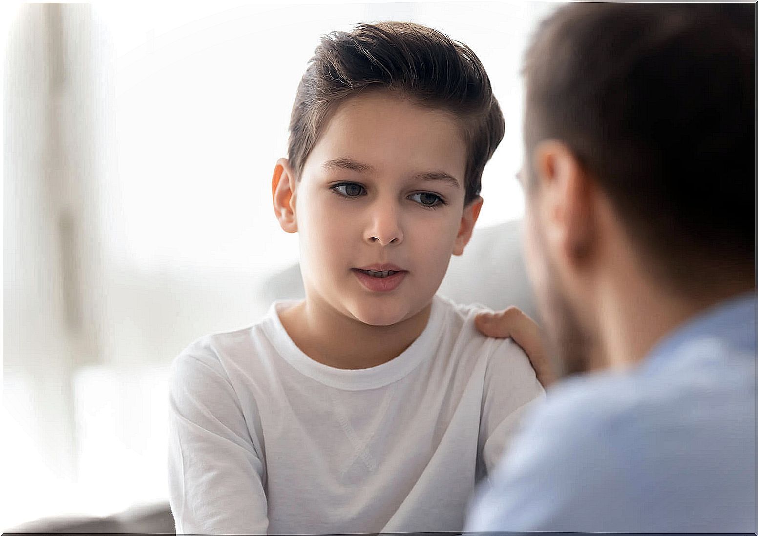 Father talking to his son to raise resilience.