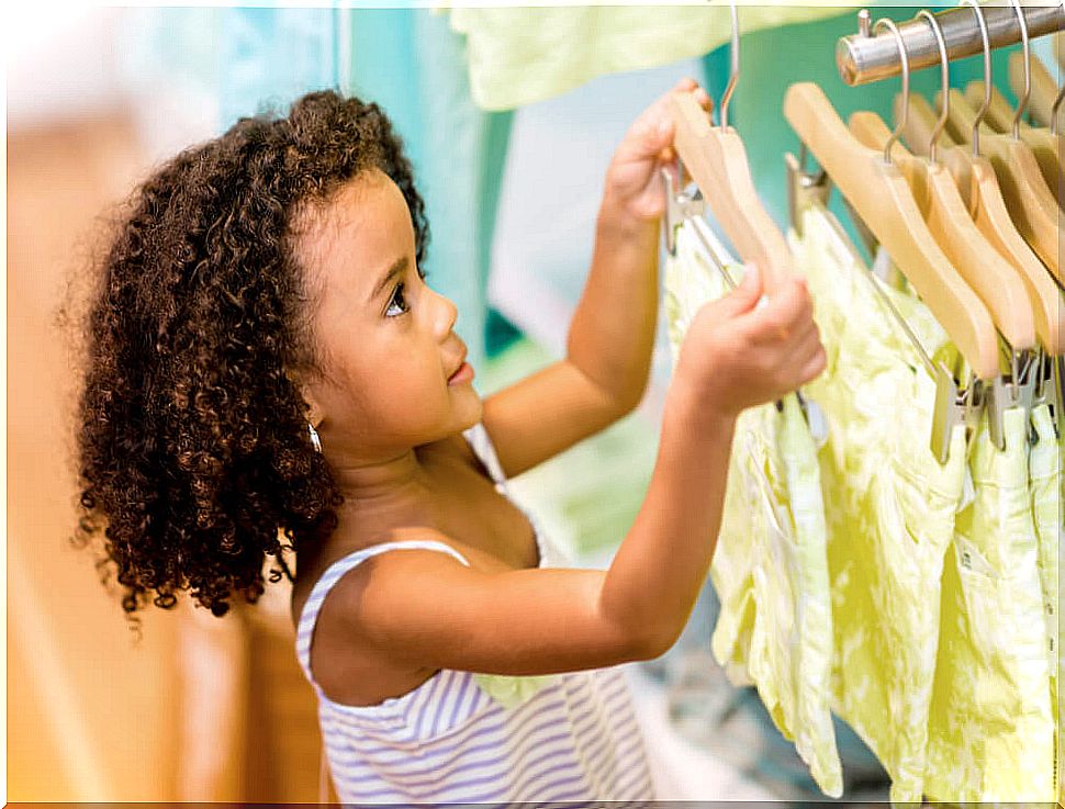 Girl shopping for clothes.