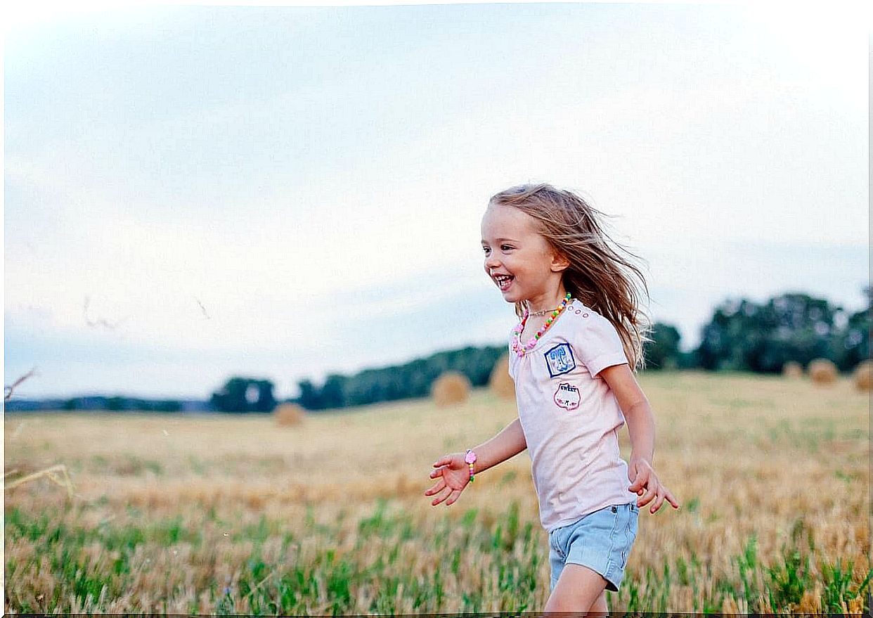 Nina running through a happy meadow