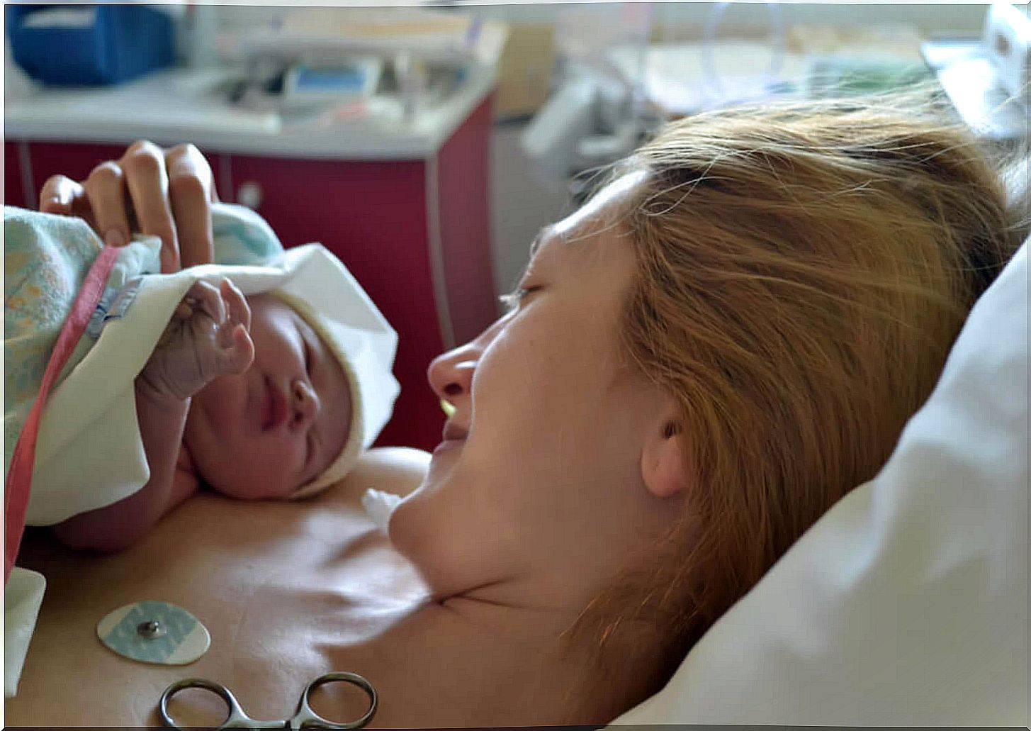 Mother with her newborn baby in her arms after suffering from neonatal sepsis.