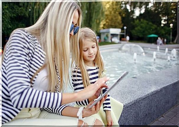 mother-and-daughter-with-a-tablet-in-hands_1157-2188