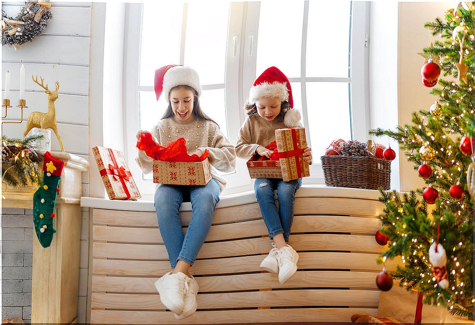 Girls opening their personalized gifts.