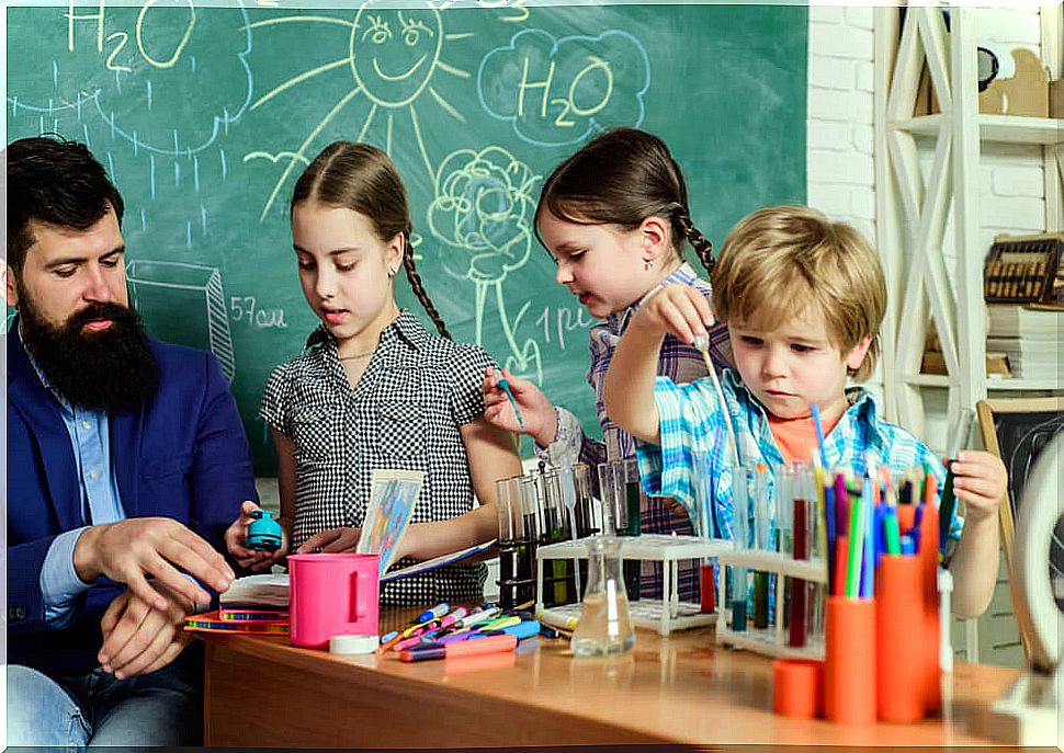 Children in science class putting their learning into practice through scaffolding.