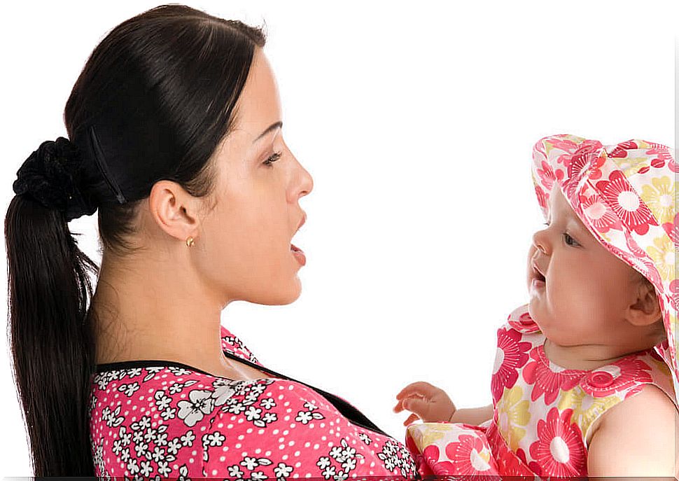 Mom talking to her baby during the prelinguistic stage.