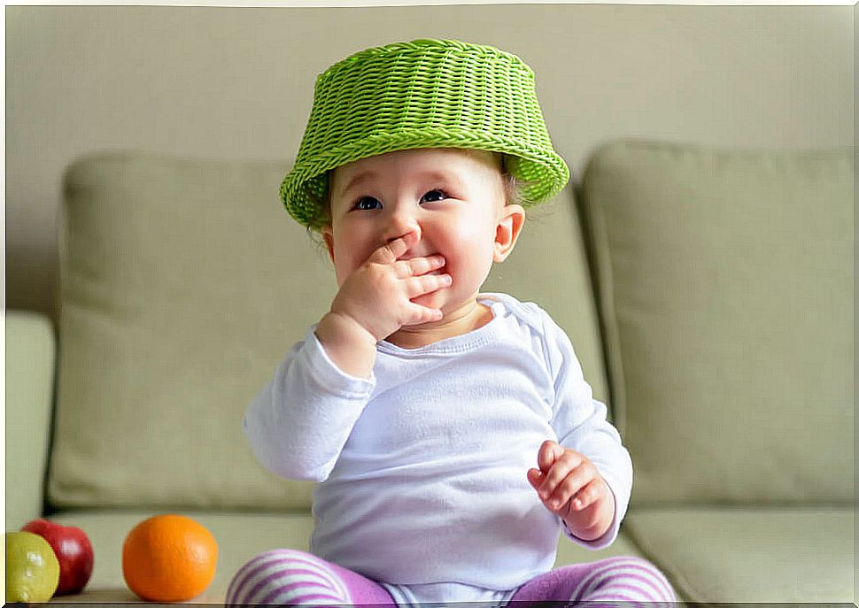 Baby playing with the treasure basket and showing that babies are altruistic.