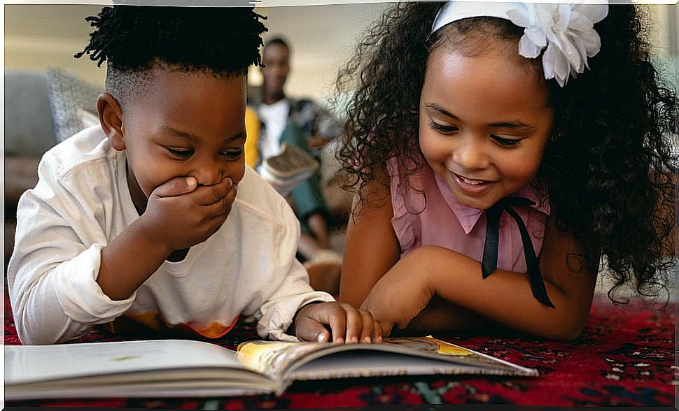 Child reading one of the stories to learn spelling.