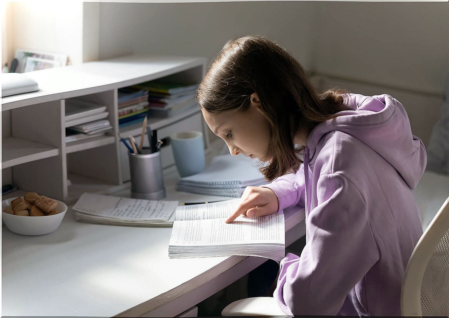 Adolescent girl in her room studying because she trusts her own judgment.