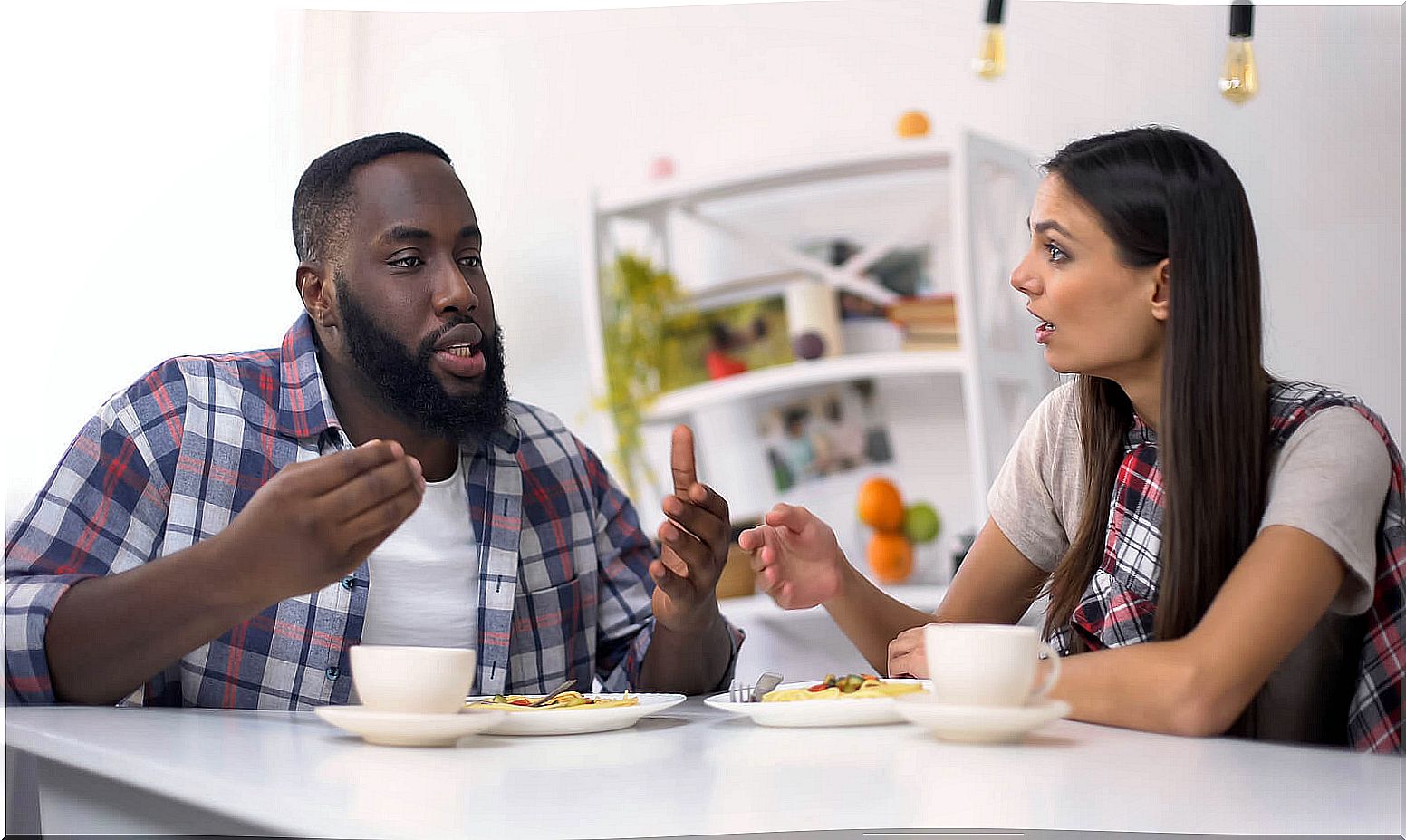 Couple arguing during breakfast.